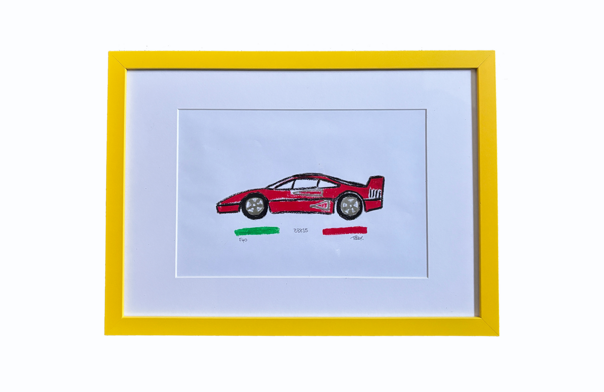 A framed oil pastel drawing featuring a hand-drawn Ferrari F40 and Chassis Number with small green and red Italian tricolore below it, set in a Modena yellow frame with signed by Teddy McDonald