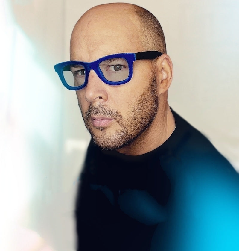 contemporary artist teddy McDonald portrait photo blue glasses italy